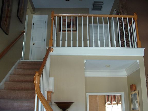 View from Foyer.  Upstairs landing overlooks the Formal Living Room