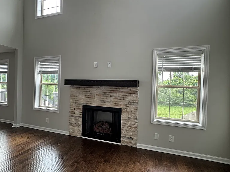 Living room:
* 16 ft ceilings and gas fireplace (service not connected)