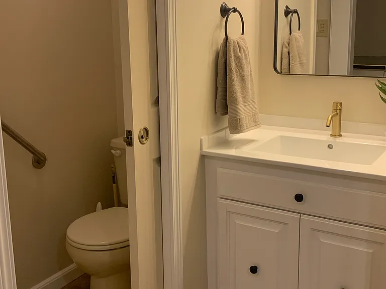 private toilet room with pocket door