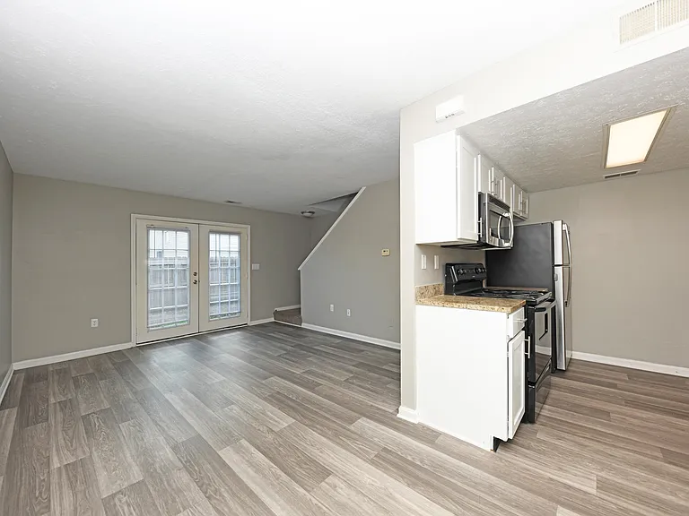 Kitchen + Living Room with Hardwood Style Flooring