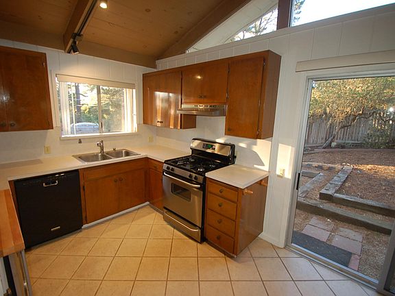 KITCHEN AND SLIDER DOOR: To the back yard.