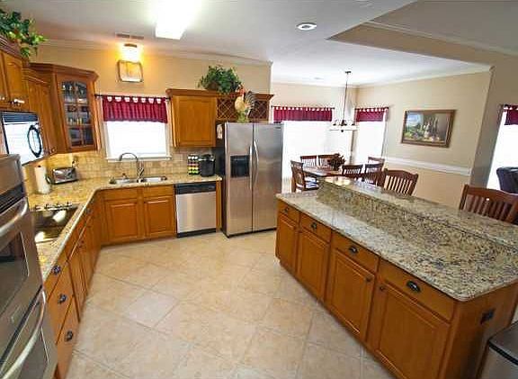 Gourmet kitchen w/ granite countertops and stainless steel appliances