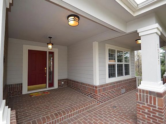 Covered front porch ideal for your morning cup of coffee or afternoon cocktails