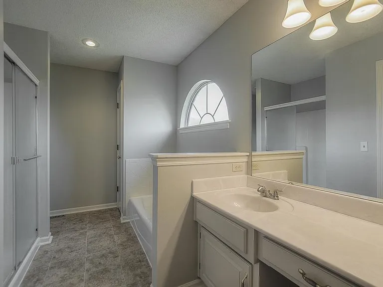 Double sinks, tub and shower