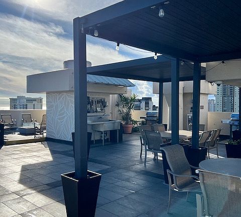 sunsetting view from pool deck (grilling stations, wash station, gas fire pit)