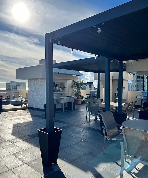 sunsetting view from pool deck (grilling stations, wash station, gas fire pit)