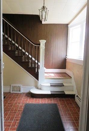 Foyer of rental property looking toward stairs