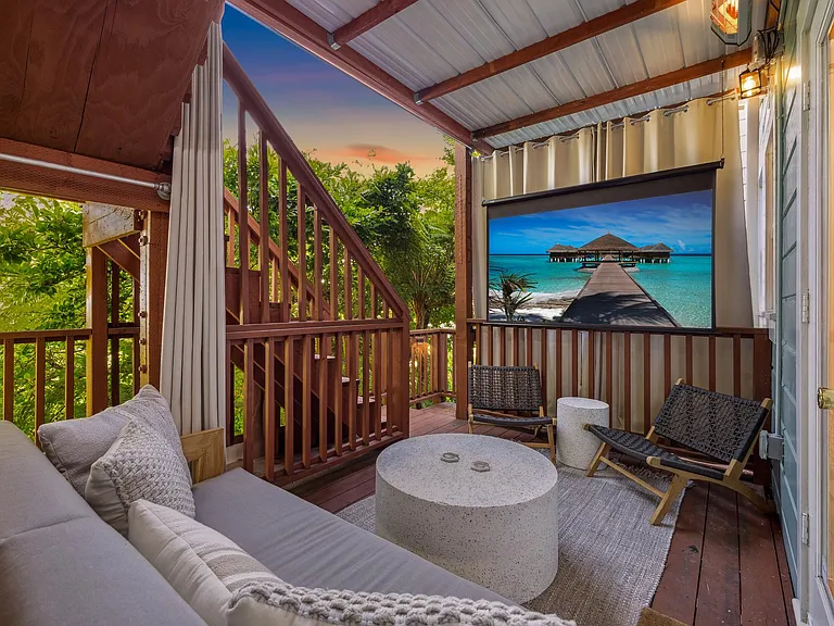 A rare San Francisco luxury: your own private and heated outdoor movie lounge with an 80" projector screen, surround sound - surrounded by lush garden greenery. An unforgettable space for entertaining, movie nights, or unwinding.