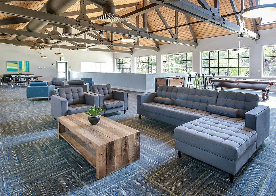 Resident Lounge with large windows and exposed beams.