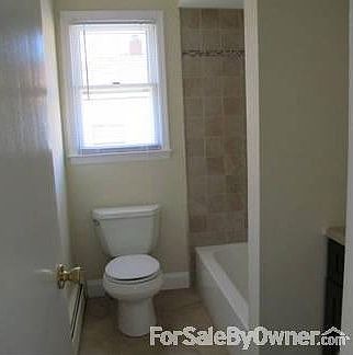 Main Bath
						:
						New bath, neutral with glass tile accents