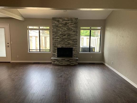 Living room with wood-burning fireplace