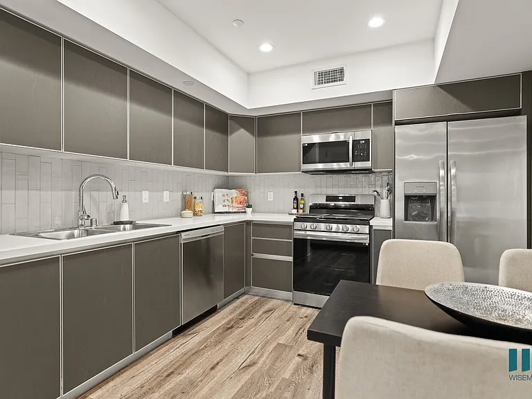 Kitchen with Stainless-Steel Refrigerator, Stove, Microwave Oven, and Dishwasher
