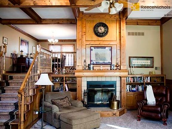 Great Room with soaring fireplace and master woodwork