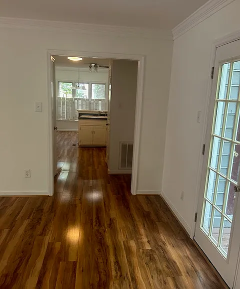 living space with entrance to kitchen and french doors to the right for access to outdoor space