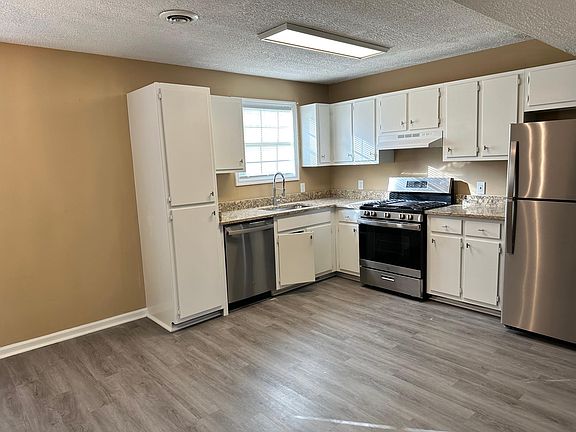 Freshly painted cabinets, new dishwasher and refrigerator. All new lighting throughout.