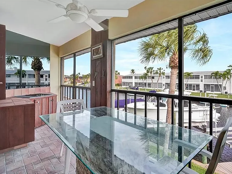 Screened balcony with Jen Air grill