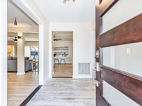 Entry foyer leading to inviting open floor plan. Fresh interior and exterior paint.