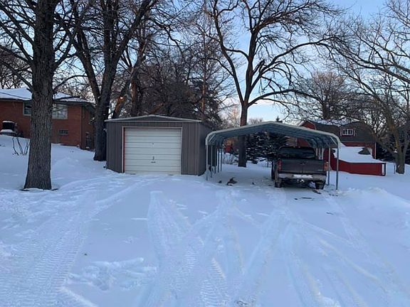 Detached garage and car port