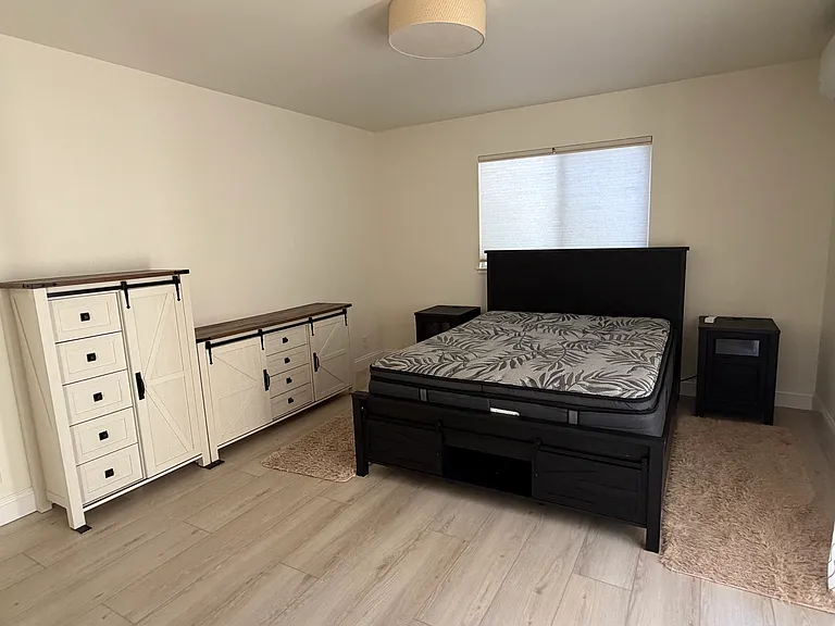 Master bedroom with furniture.