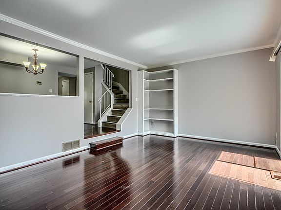 Living Room w/Wood Floors and built in shelves