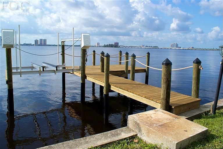 New dock with boat lift and sit out.