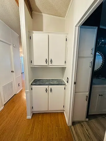 Additional storage outside hall bathroom.