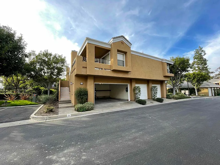 View from the front of the house with the garage open.