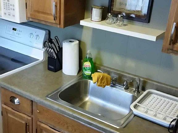 Kitchen with full size stove and refrigerator
