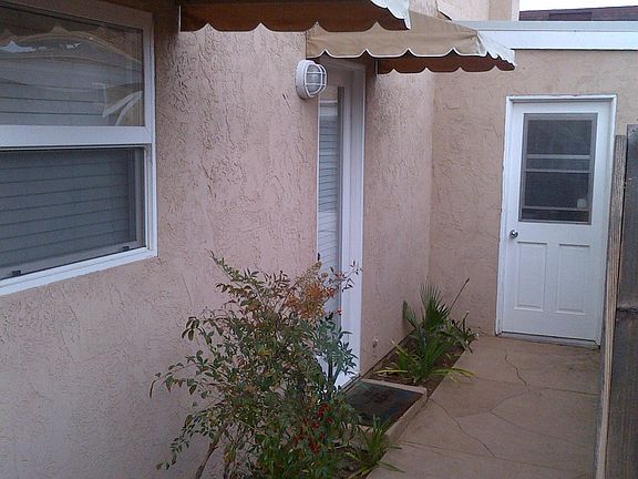 Second entrance to the condo off of the kitchen. Also, there is a semi-private laundry on-site a few steps from the condo.