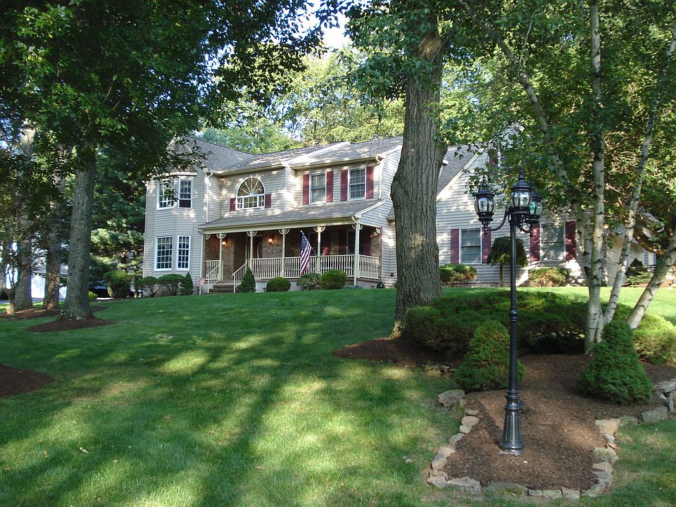 Professionally landscaped 1.2 acre cul-de-sac lot with public sewer/water.