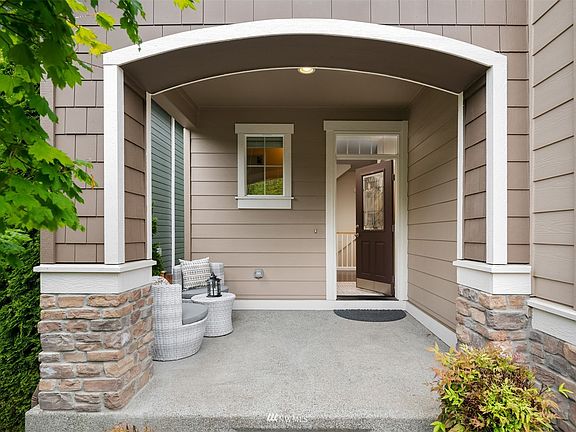 Private covered front porch for a welcoming entrance.