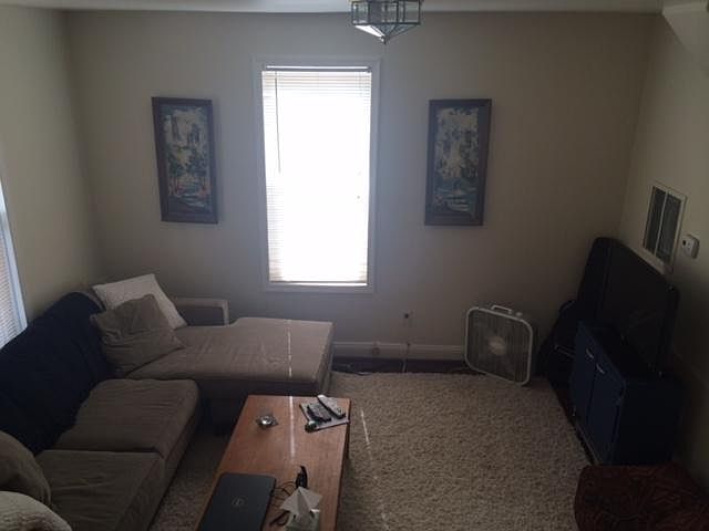Living room (pictured furnished) House is NOT furnished.