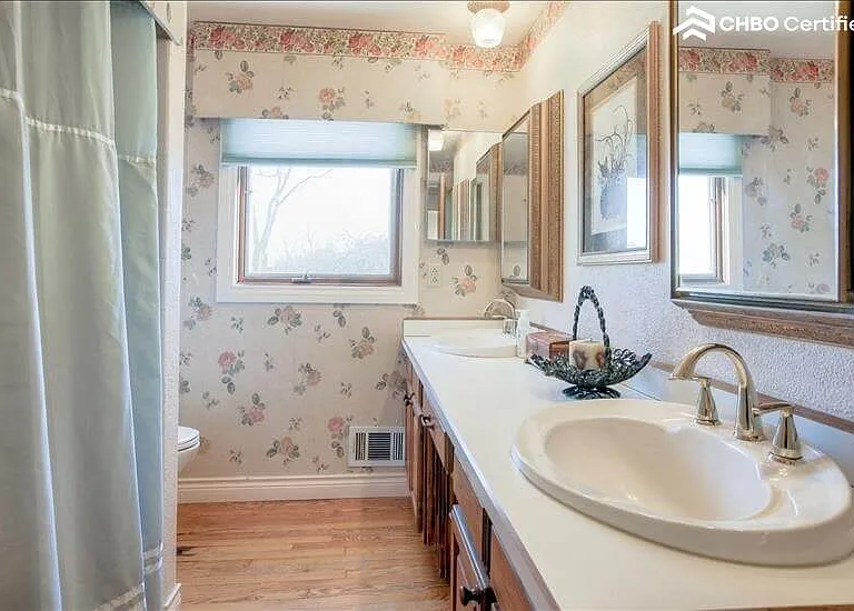 Full bath with his and her sinks.
