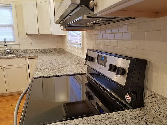 Range Microwave Subway tile Granite in Kitchen