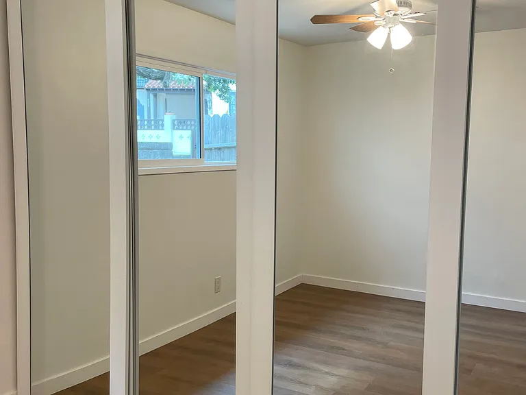 Wall to wall and floor to ceiling mirrored closet space!