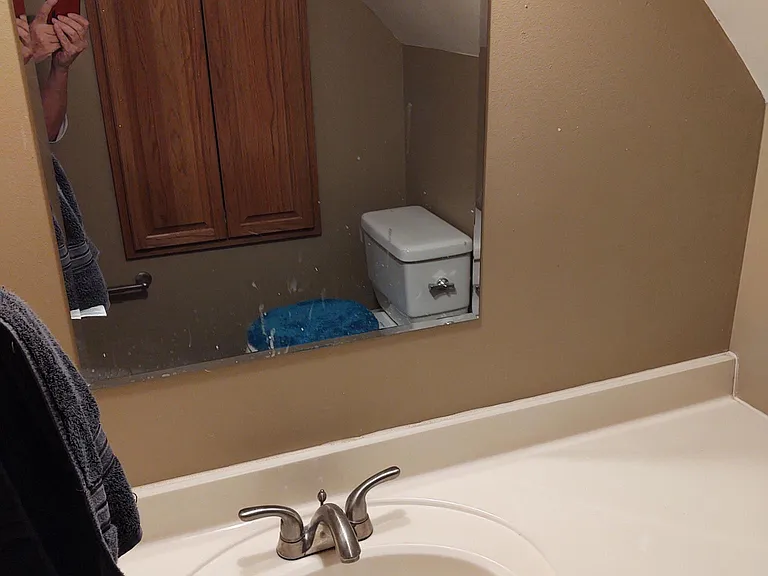 Upstairs Bathroom Vanity. Built in Cabinet Storage in Wall.