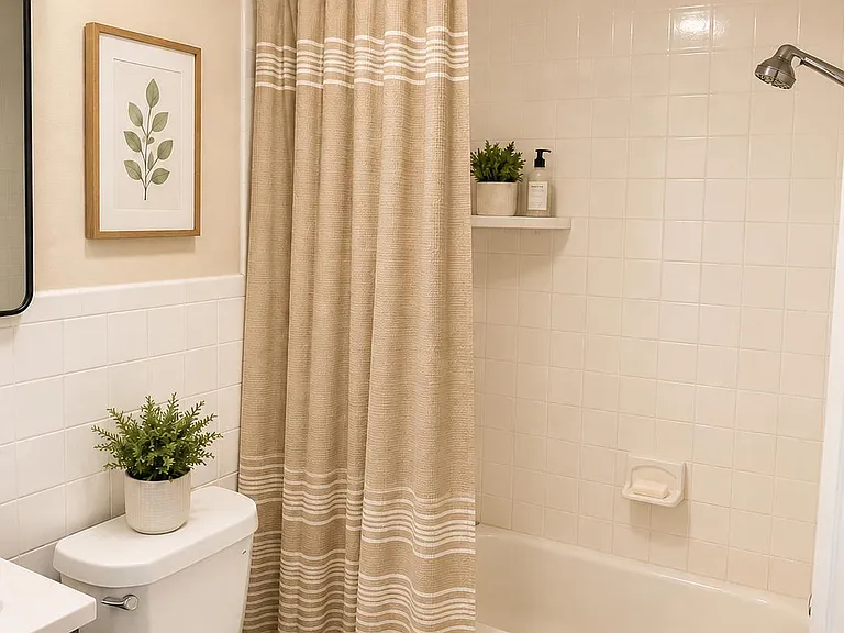 Full bath with tub/shower combo, tiled surround, and vanity storagean easy, functional setup for daily routines.