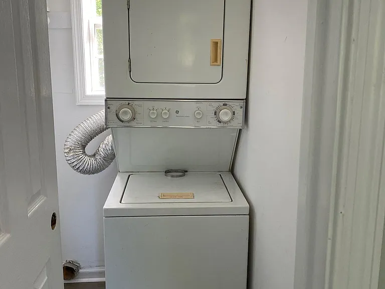 Laundry room, coat closet, pantry area.