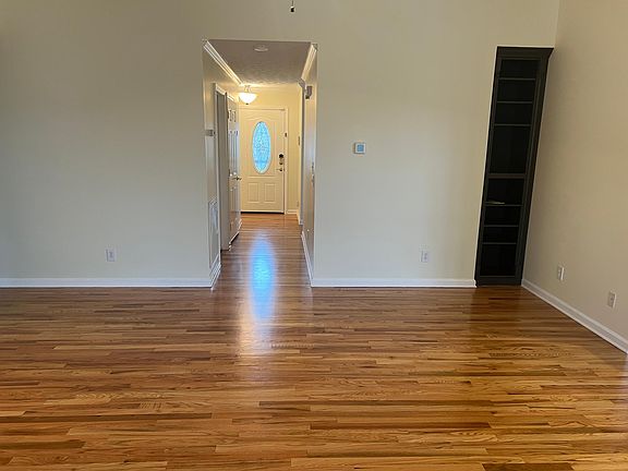 great room facing front door; build-in bookcase in corner