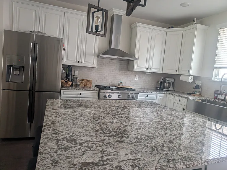 Kitchen Aid Chef's kitchen with an oversized granite island