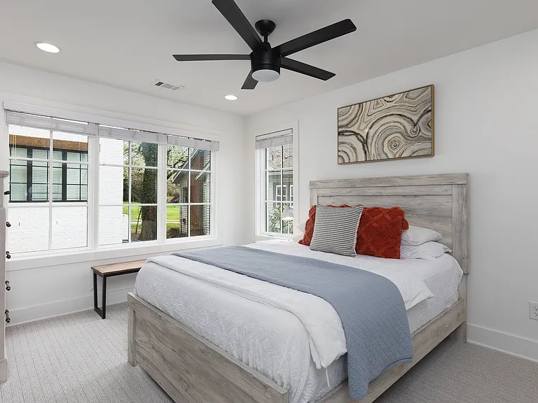 Bedroom 2 with a king bed and ensuite bath. Located on the 1st floor. Tastefully decorated with high-end modern furnishings and thoughtful touches to make your stay as comfortable as possible.