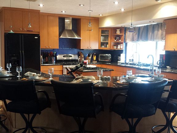 Kitchen with bar and island