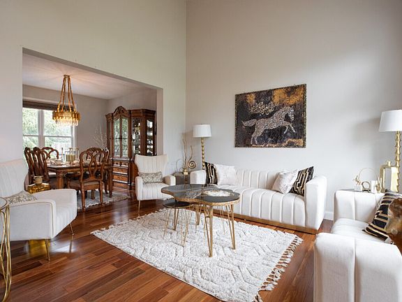 formal living room with formal dining room great for entertaining guests