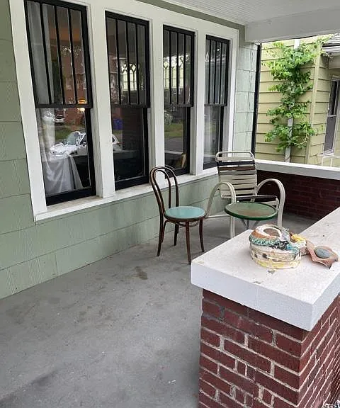 A cozy front porch for enjoying your favorite morning beverage.