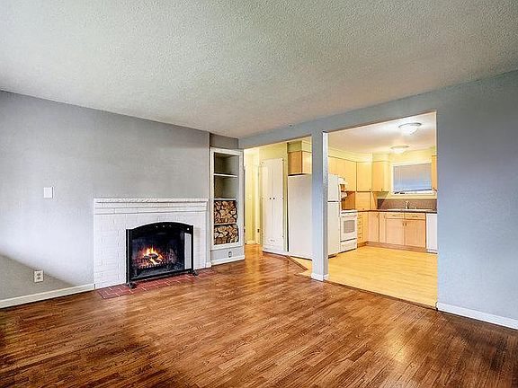 Front room with wood burning fireplace.