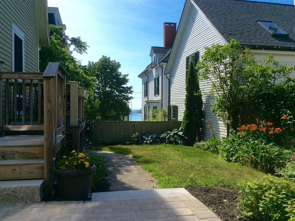 Apartment located on back side of building with lovely yard.