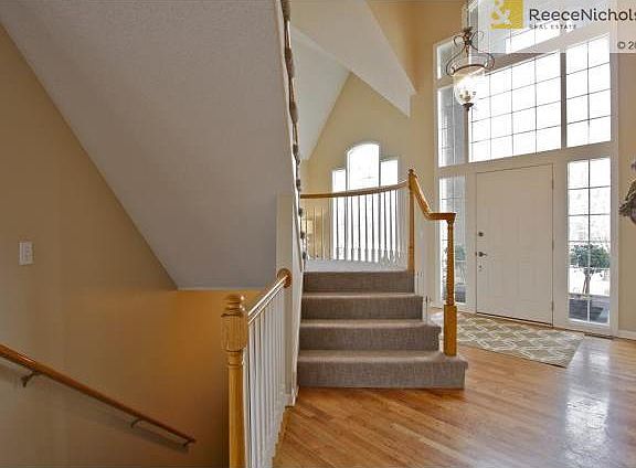 Beautiful entry opens to soaring ceilings and a curved staircase