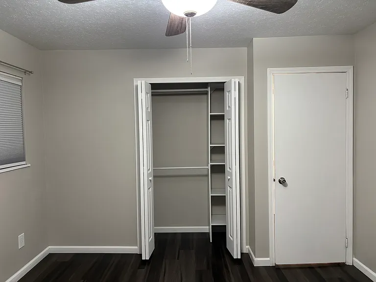 Master Bedroom: Closet has built-in shelves and two hanging rods for all the clothes