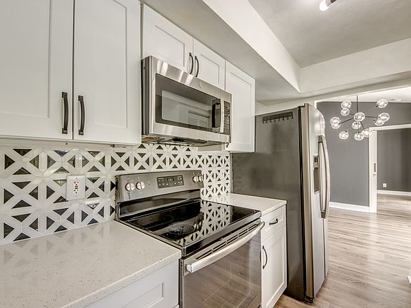 Designer tile backsplash! Newly updated kitchen with stainless appliances.