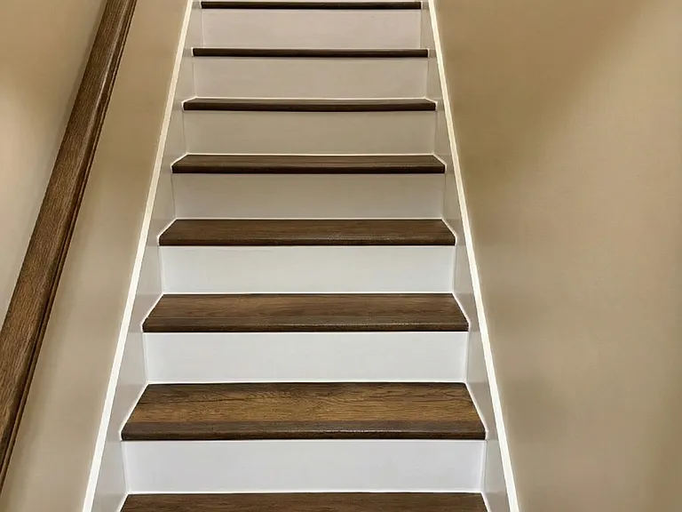 Stairs to upstairs bedroom and full bathroom.